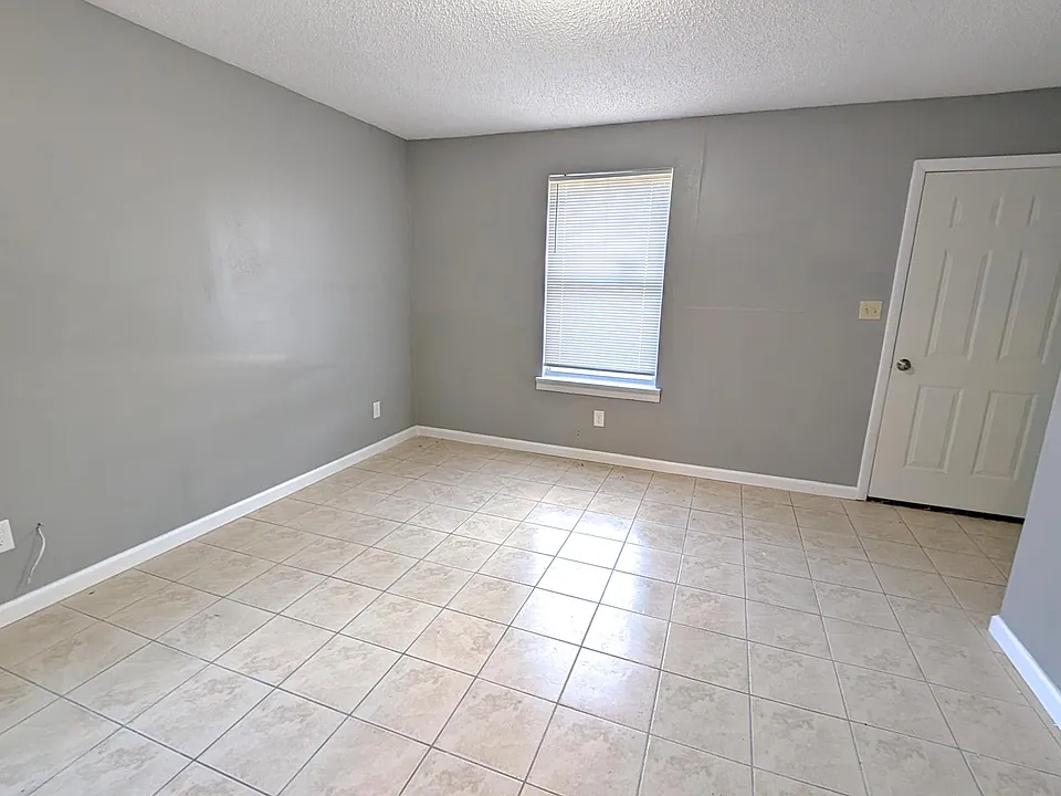 Spacious living room ready for your personal touch