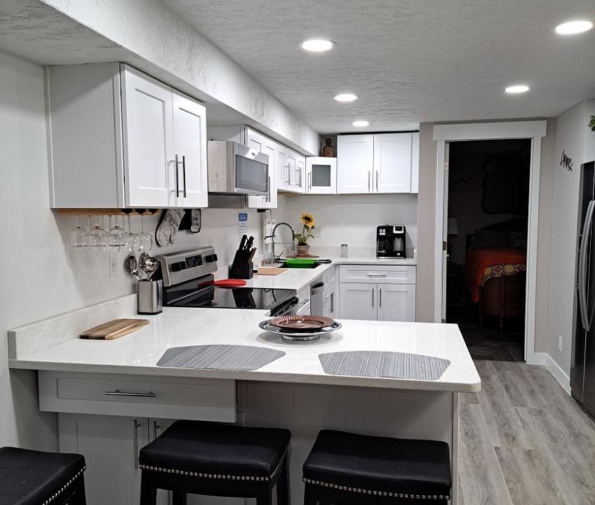 Open floor plan, kitchen, dinning and living room. Counter outlets have USB ports.