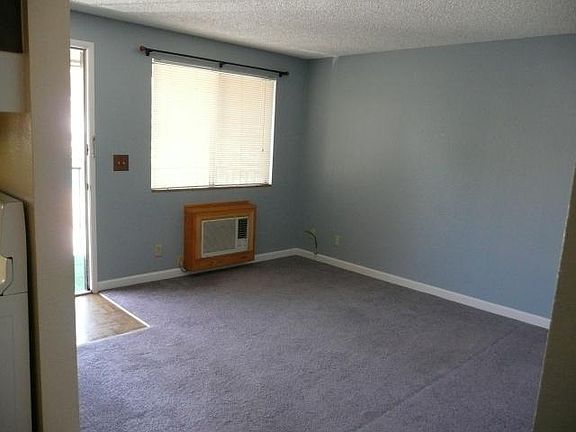 Front door open and front room.