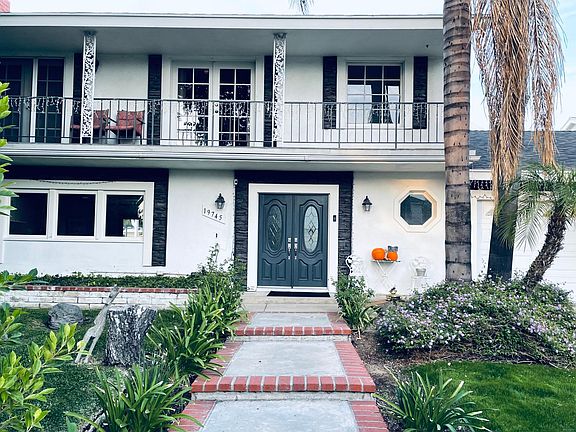 house with huge balcony on second floor