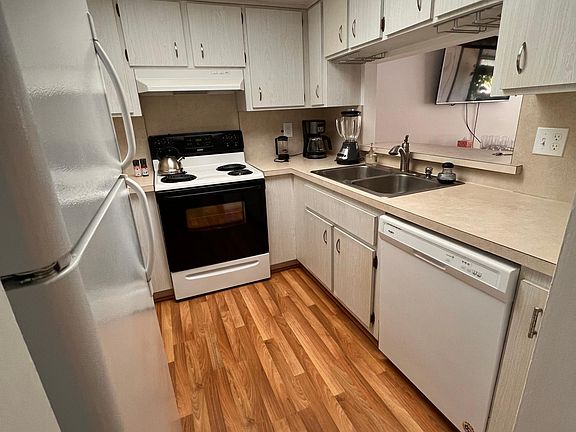 Fully stocked kitchen into living room