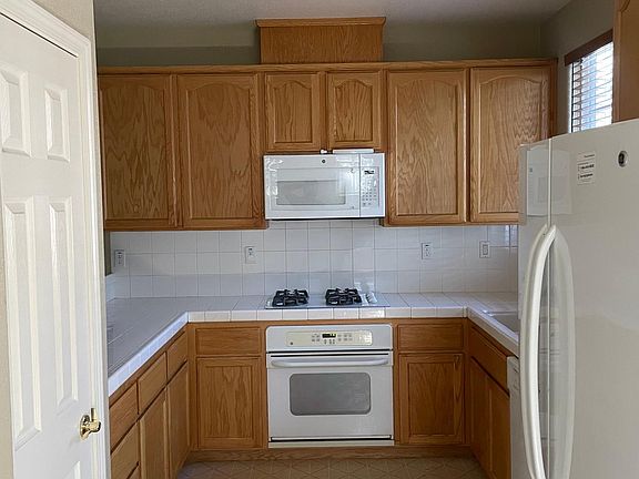 Kitchen with lots of cabinets and a gas range
