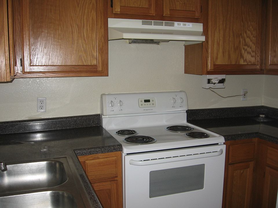 Kitchen has electric stove, refrigerator & garbage disposal.