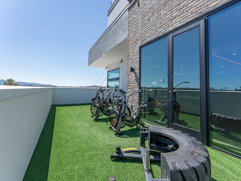 Outdoor Fitness Deck with Bikes and Mountain Views