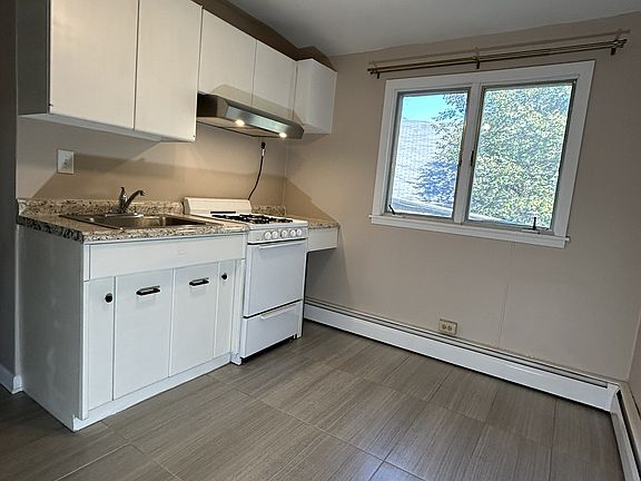 Kitchen other view. Brand new tile flooring.