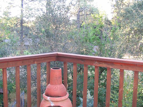 balcony off bedroom. Trees and view below