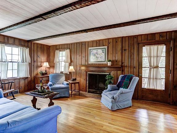 Front living room with door leading to relaxing side porch