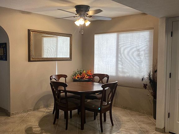 Dining table, two seating at the island, two seating at the bar area