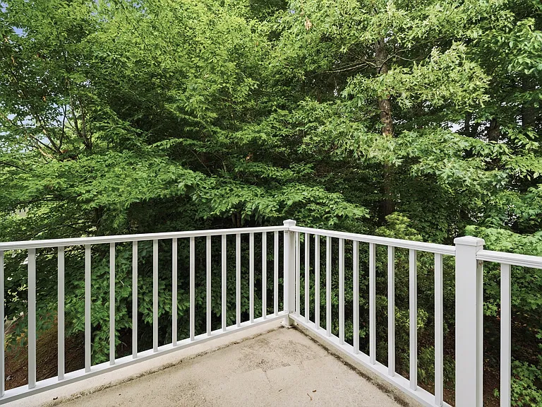 Second floor balcony with wooded view