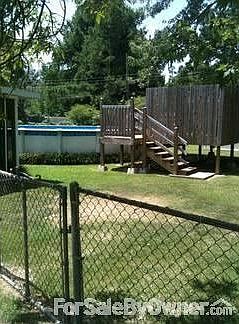 backyard
						:
						chainlink fence, pool and side of deck