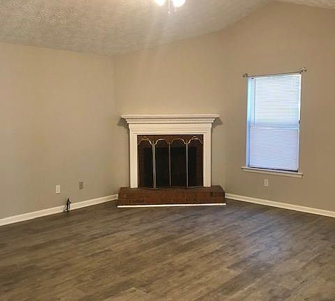 Fireplace in large living room.