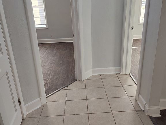 View from the hall into the 2 bedroom entrances