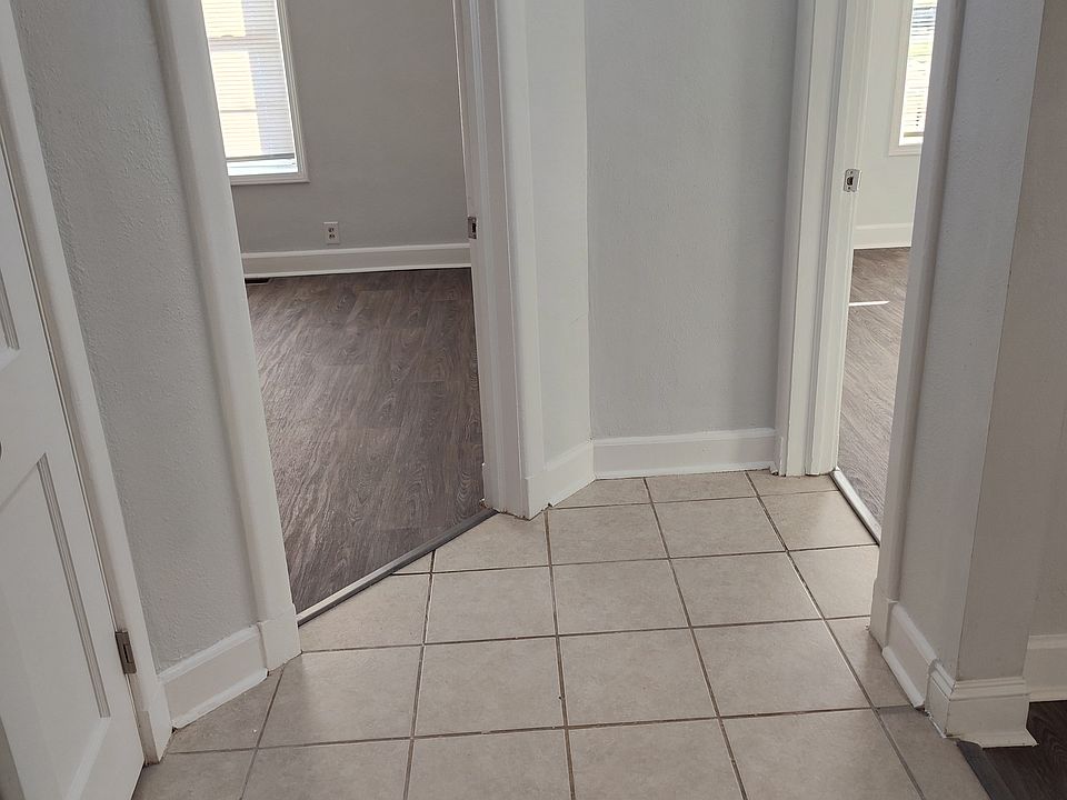 View from the hall into the 2 bedroom entrances