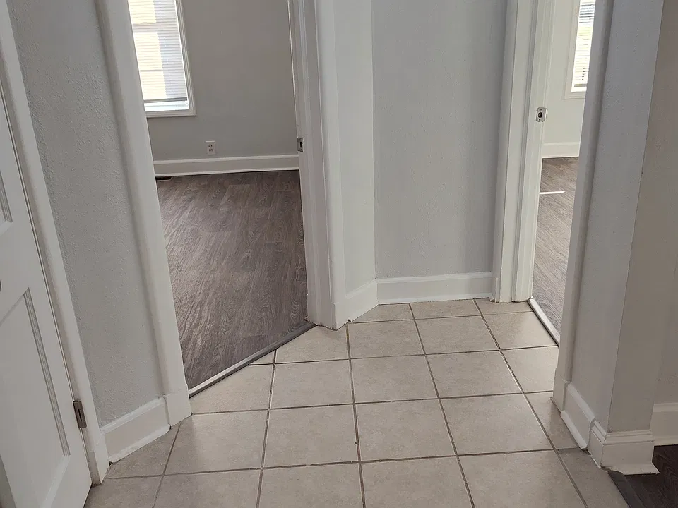 View from the hall into the 2 bedroom entrances