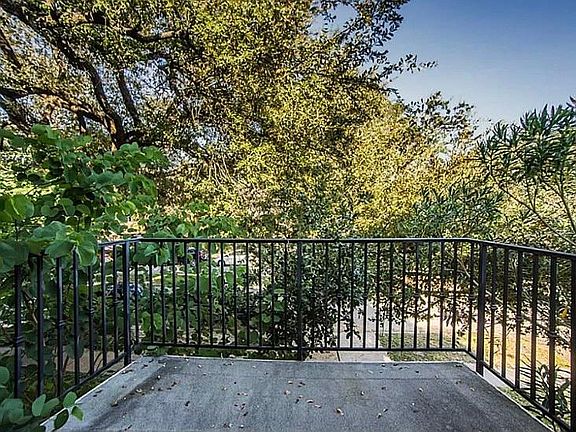 Balcony off living room overlooking front of house