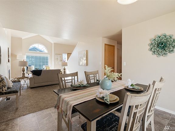 The combined space of the living room and dining room creates one large area for everyday living.
