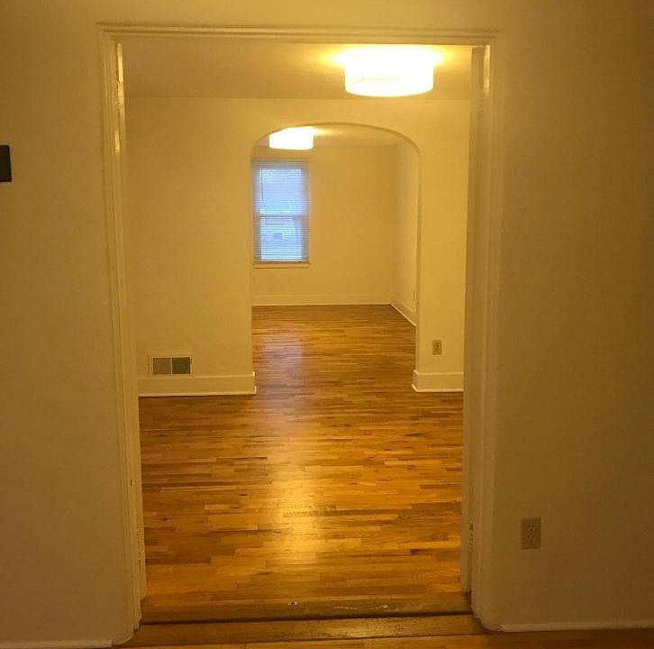 View from living room thru dining room to back bedroom