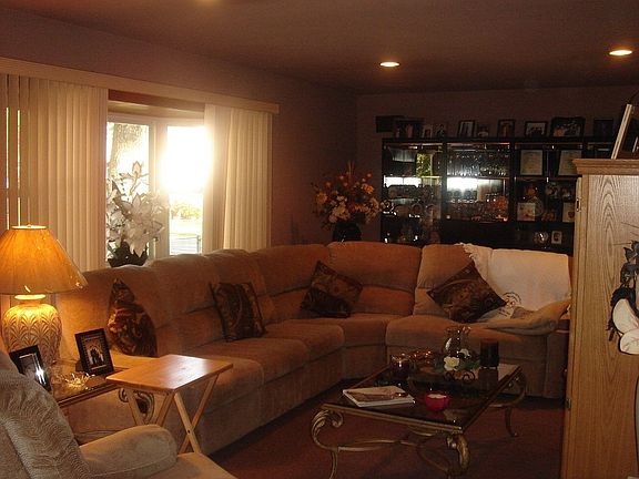 The Family Room is complete with hardwood floors and a bay window