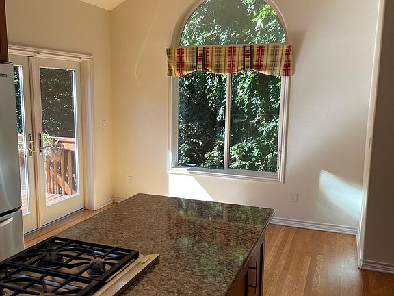 Dining Nook with bright windows and French doors to deck