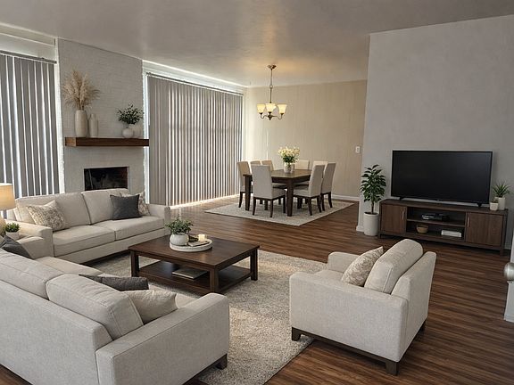 Living room into dining room.
*digitally staged