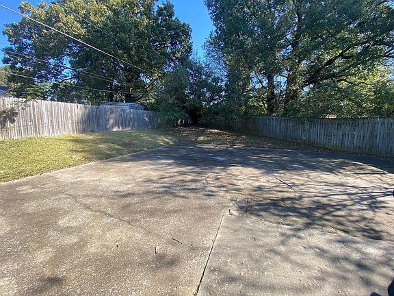 Large back yard with privacy fence.