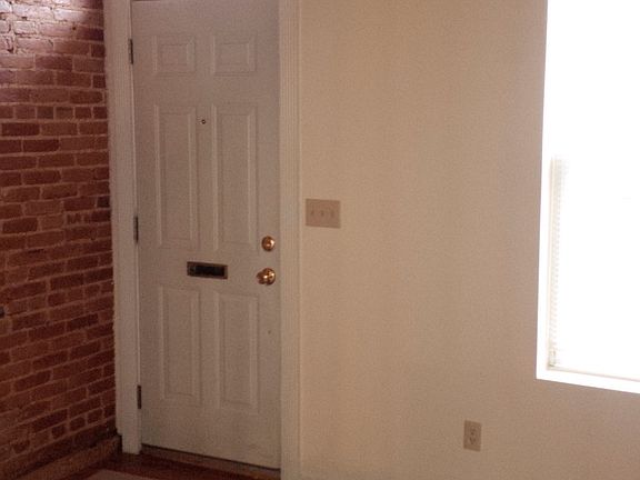 Living Room with exposed brick.