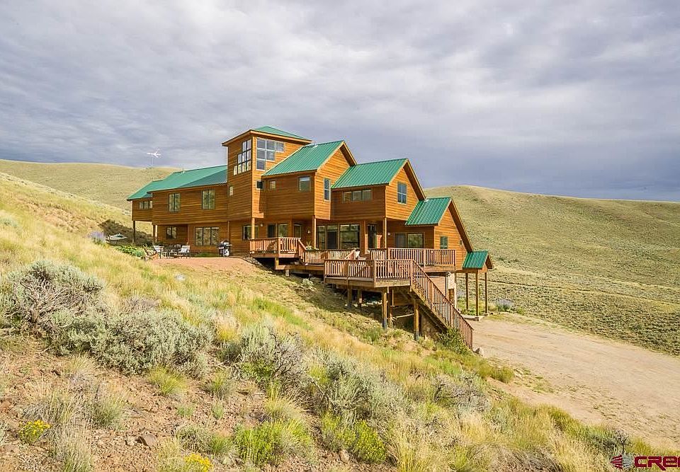 Spectacular views of Ohio Creek Valley, Carbon Peak, Anthracites, from this custom home, 447 Sage Dr