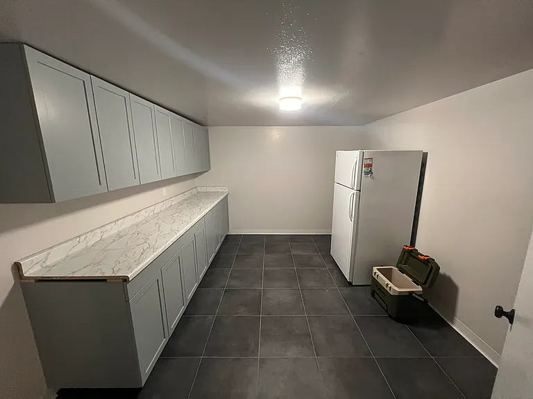 Extended kitchen area + cabinetry and storage