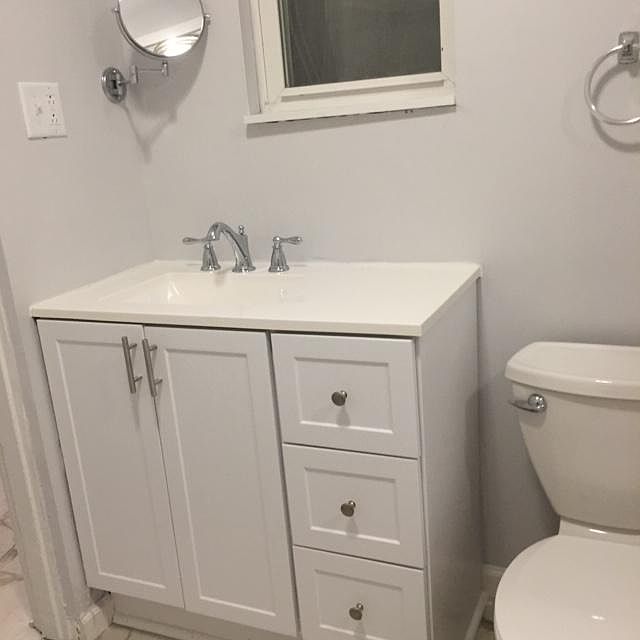 Newly renovated bathroom - vanity, shower surround and tub, floor
