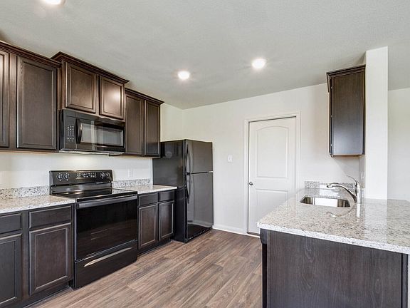 The kitchen comes with a full suite of energy-efficient appliances