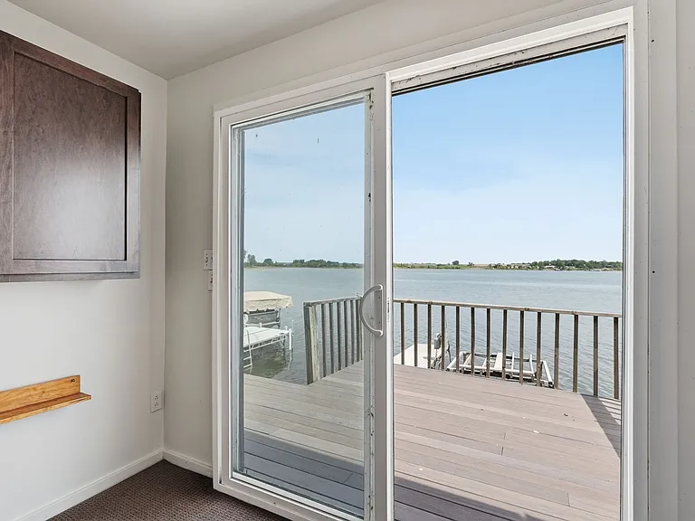 Lake view & private deck from the bonus room. Enjoy the sound of the waves lapping onto the shore in complete comfort in here!