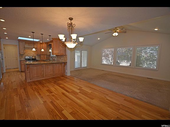 Hardwood floors, open family room with vaulted ceilings