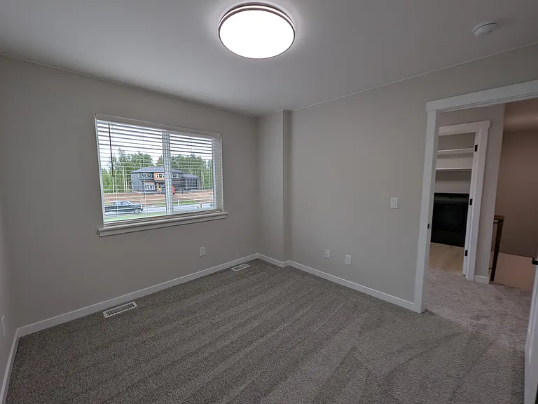 Bedroom 1, facing front of house.