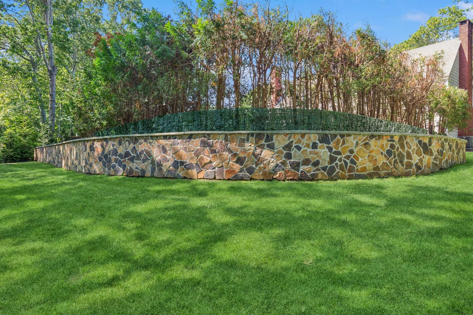  Srone retaining wall in side/backyard