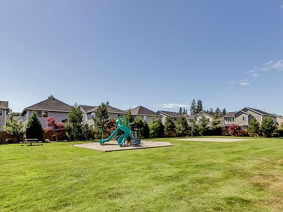 Community park is immediately to adjacent to the house's back yard
