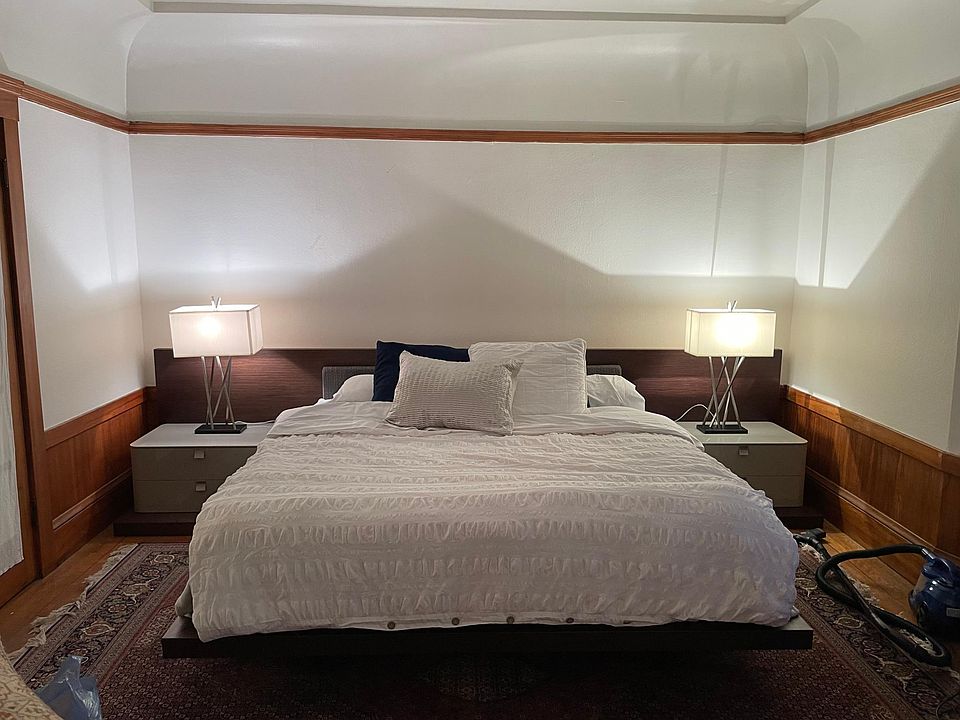 contemporary furnishings in Edwardian home. King bed and living room