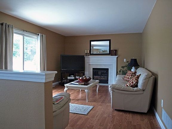 Family Room with fireplace leading to deck
