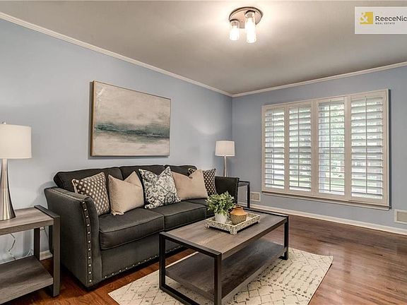 Gorgeous plantation shutters on front of home. Spacious room is perfect for home office.