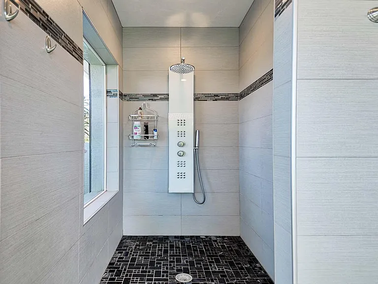 Large hydromassage shower. Window with opaque glazing