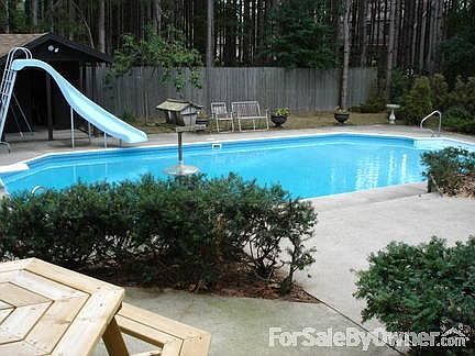 Pool view from the picnic and grill area
						:
						The fence is now a lovely purple, looks bright and cheery.