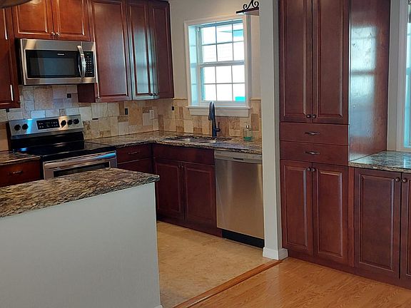 Built-in pantry to the left of the built-in buffet under the dining room window.