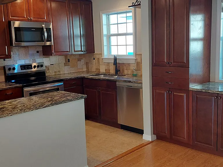 Built-in pantry to the left of the built-in buffet under the dining room window.