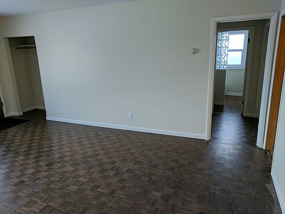 Living room, view to hallway and bathroom