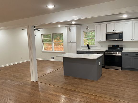 Open kitchen floor plan with new 4-5 seat Island, new quartz counter tops, brand new cabinets and appliances.