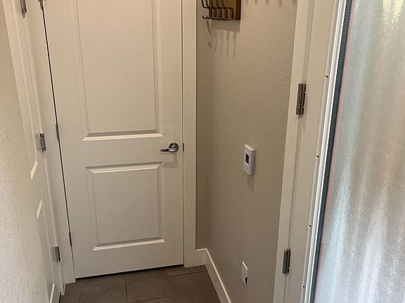 Entrance, coat closet, and access to garage