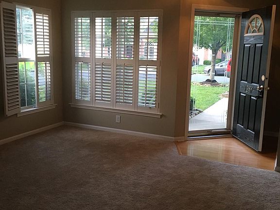Other angle of front door with french blinds