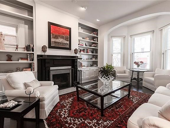 Gorgeous built-in bookcases flank the fireplace.