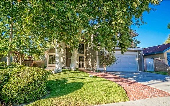 Mature tree decorate front and back yard.