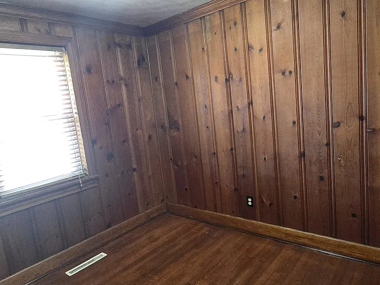 Wood-paneled bonus room_ideal for a private study/office.