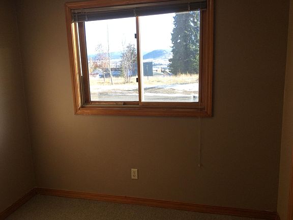 Small bedroom with closet and window.